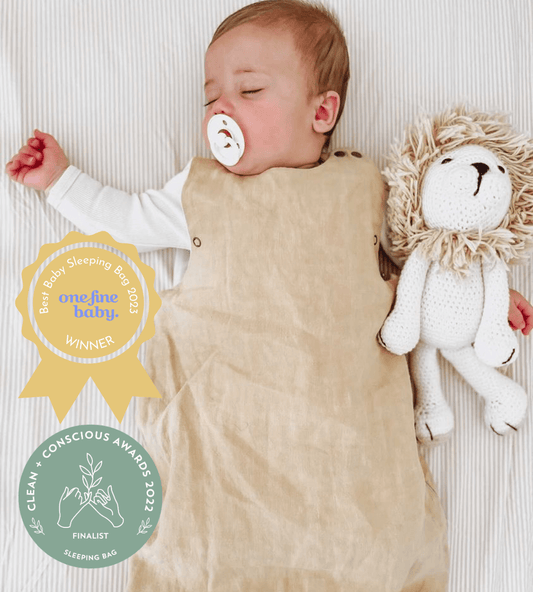 baby wearing golden sand sleeping bag
