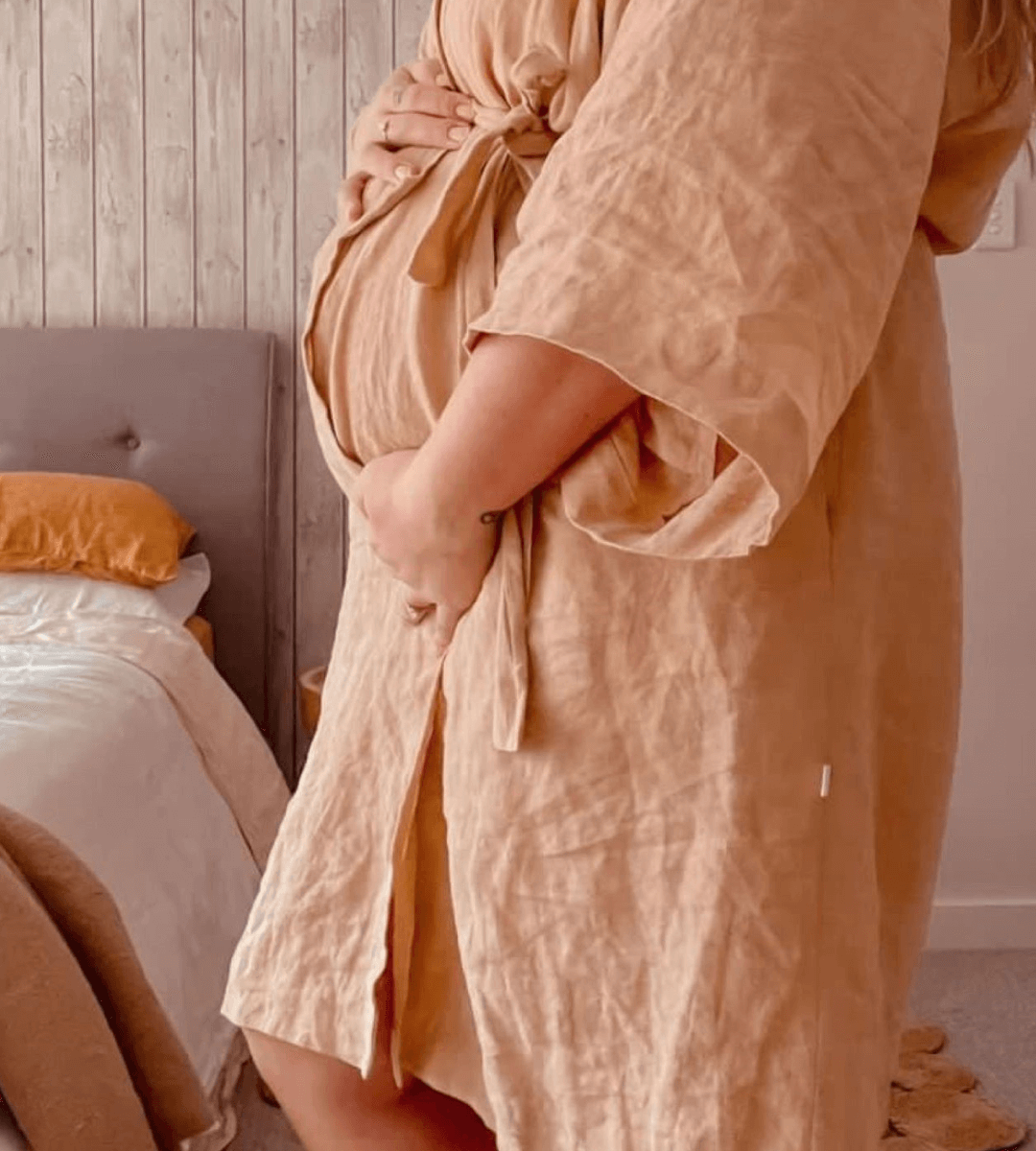 linen bathrobe over maternity bump